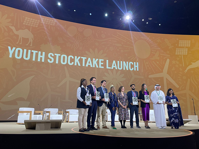 Ms. Lucy Plummer, SGI UK (center, fifth from left), at the launch of the Youth Stocktake Report at COP28, Dubai, UAE